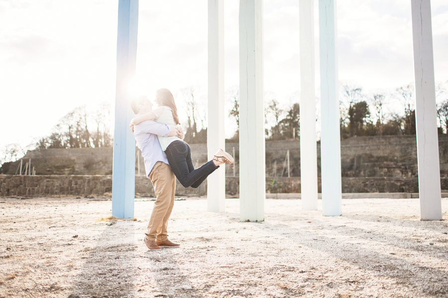 Spring Engagement shoot at Dysart Harbour in Fife - couple at sea beams statue