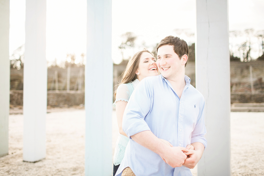 Spring Engagement shoot at Dysart Harbour in Fife - couple hug by sea front